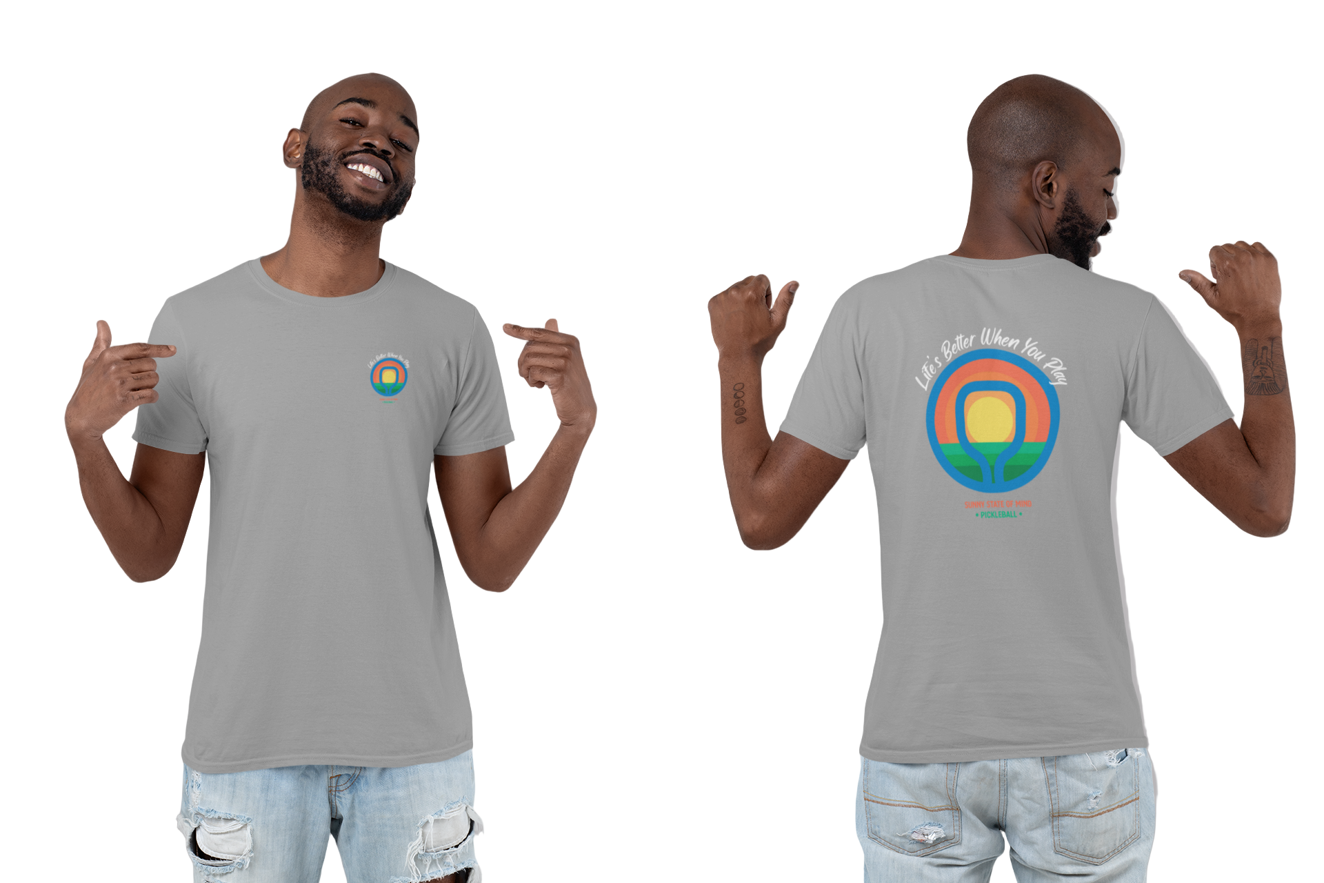 Man wearing a gray t-shirt with a colorful graphic on the front and back, pointing at the design.