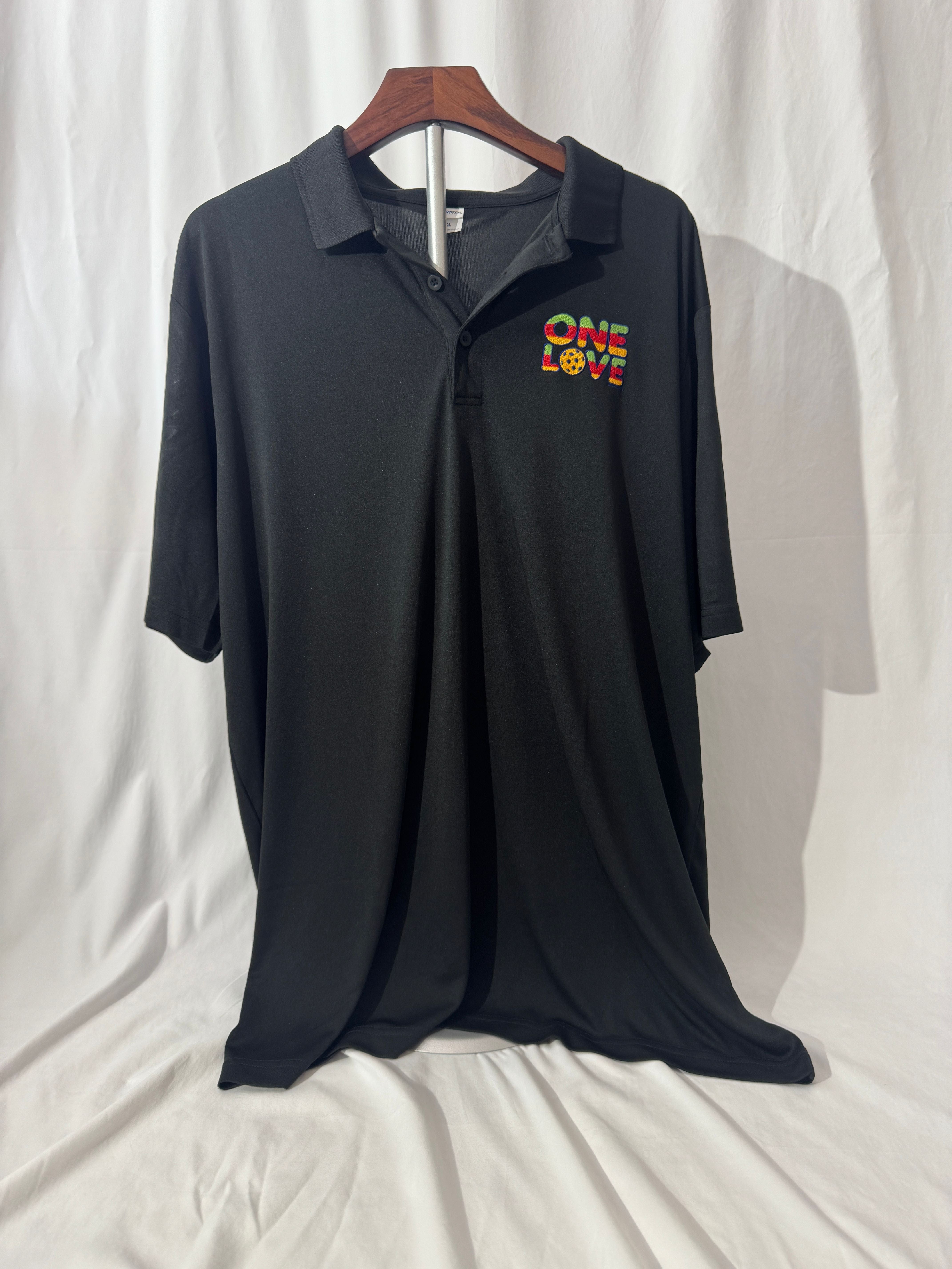 Black polo shirt with 'ONE LOVE' text on a white background